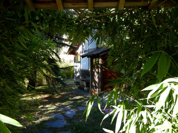 Peeking through the gate at the house within. It must belong to some very important person, situated as it is on land made sacred with much labor, love, and self-sacrifice by Alan Chadwick and those who worked with him these fourty-two years ago.