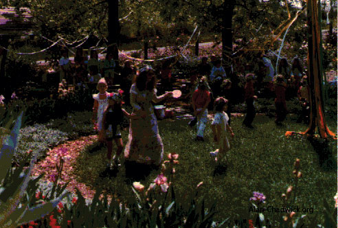 The exhuberance of the May Day celebration with flowers, children and dancing.